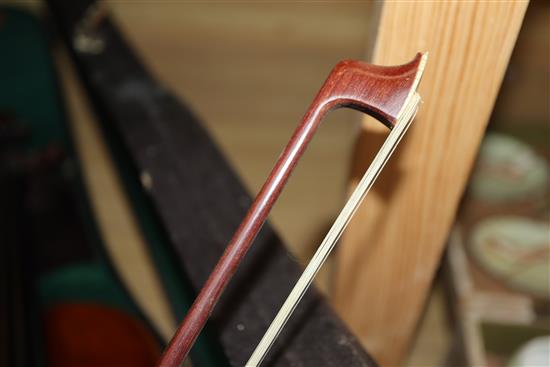 A German Strad style violin and a small violin and two bows